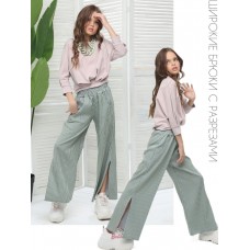 Широкие брюки с разрезами светло-зеленые